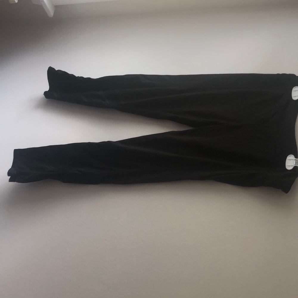 Black capri leggings, sheer material on bottom